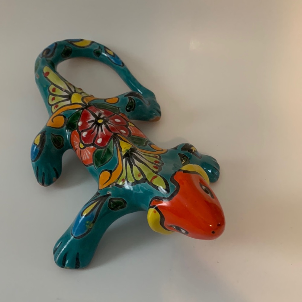 Colorful Lizard with a hole on the bottom to hang. Great to display on table.